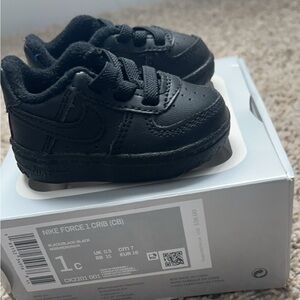 Black Air Force 1 crib shoes.